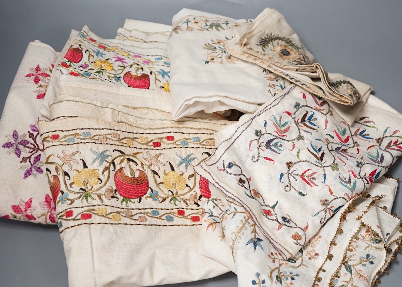 A collection of 19th century Turkish towels and runners, etc., embroidered with gold and silver and polychrome threads